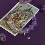 Amethyst and clear crystal bead bracelet with dangling cross charm