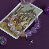 Amethyst and clear crystal bead bracelet with dangling cross charm