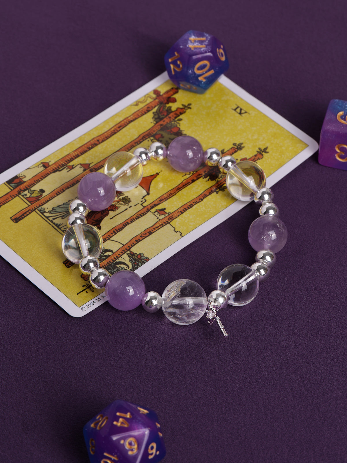 Purple and clear crystal bead bracelet with silver beads and cross charm
