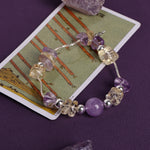 Lavender and clear beaded bracelet with metal clasp and round accent beads