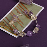 Lavender and clear beaded bracelet with metal clasp and round accent beads