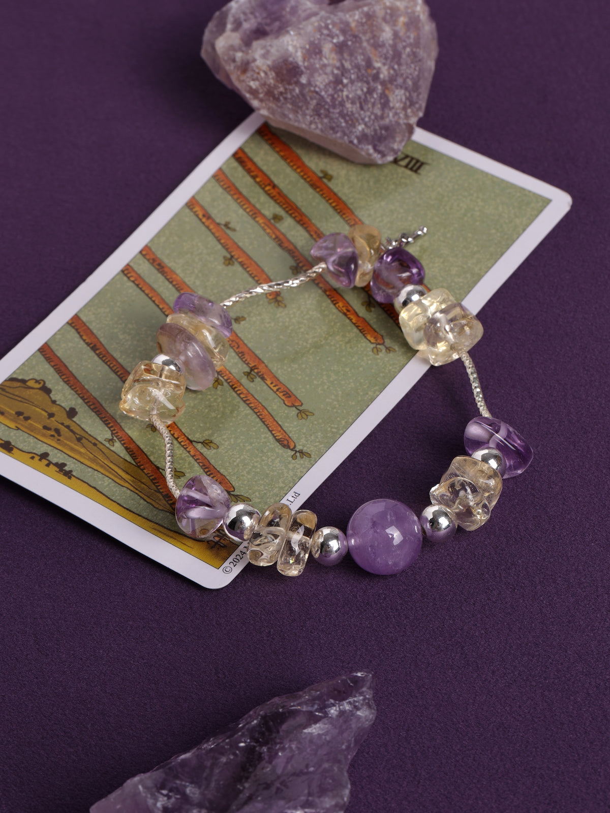 Lavender and clear beaded bracelet with metal clasp and round accent beads
