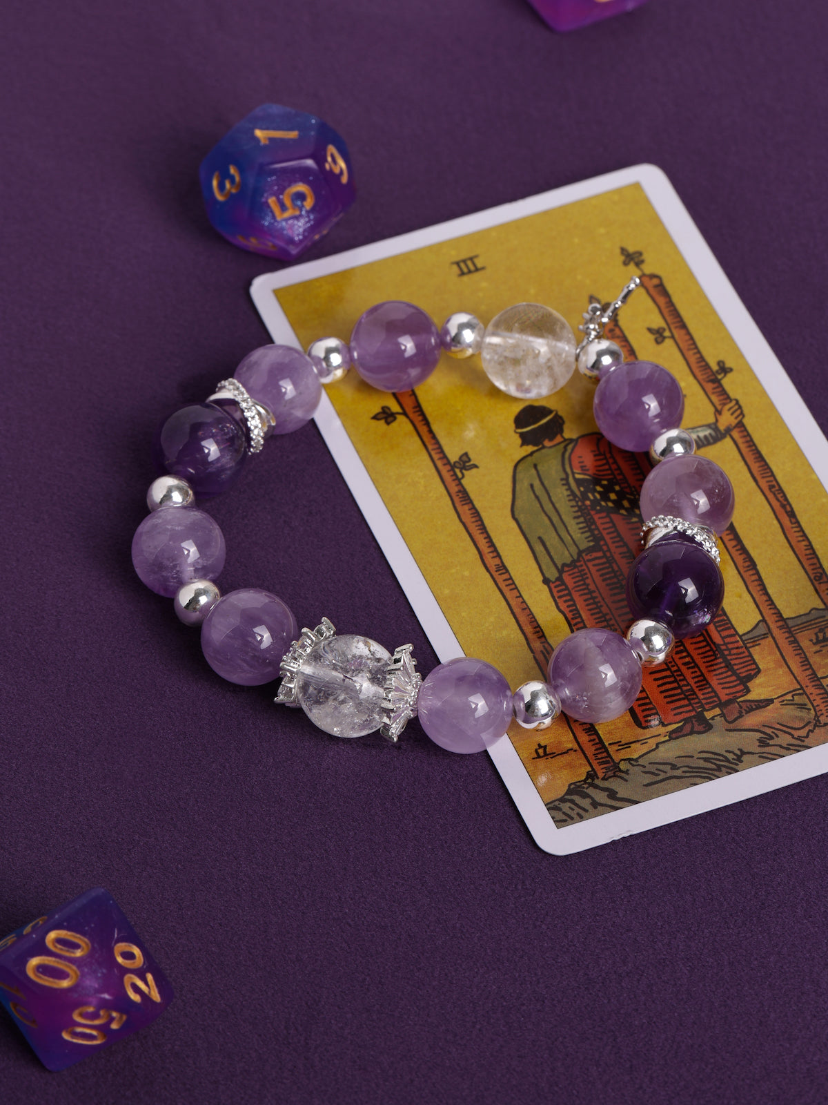 Purple and clear crystal bead bracelet with silver-tone spacers and small charm