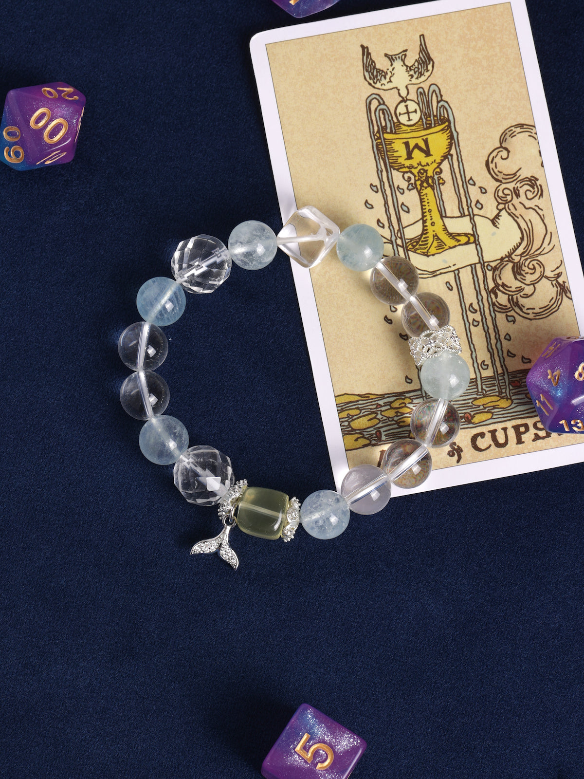 Light blue and clear beaded charm bracelet with fish and starfish pendants