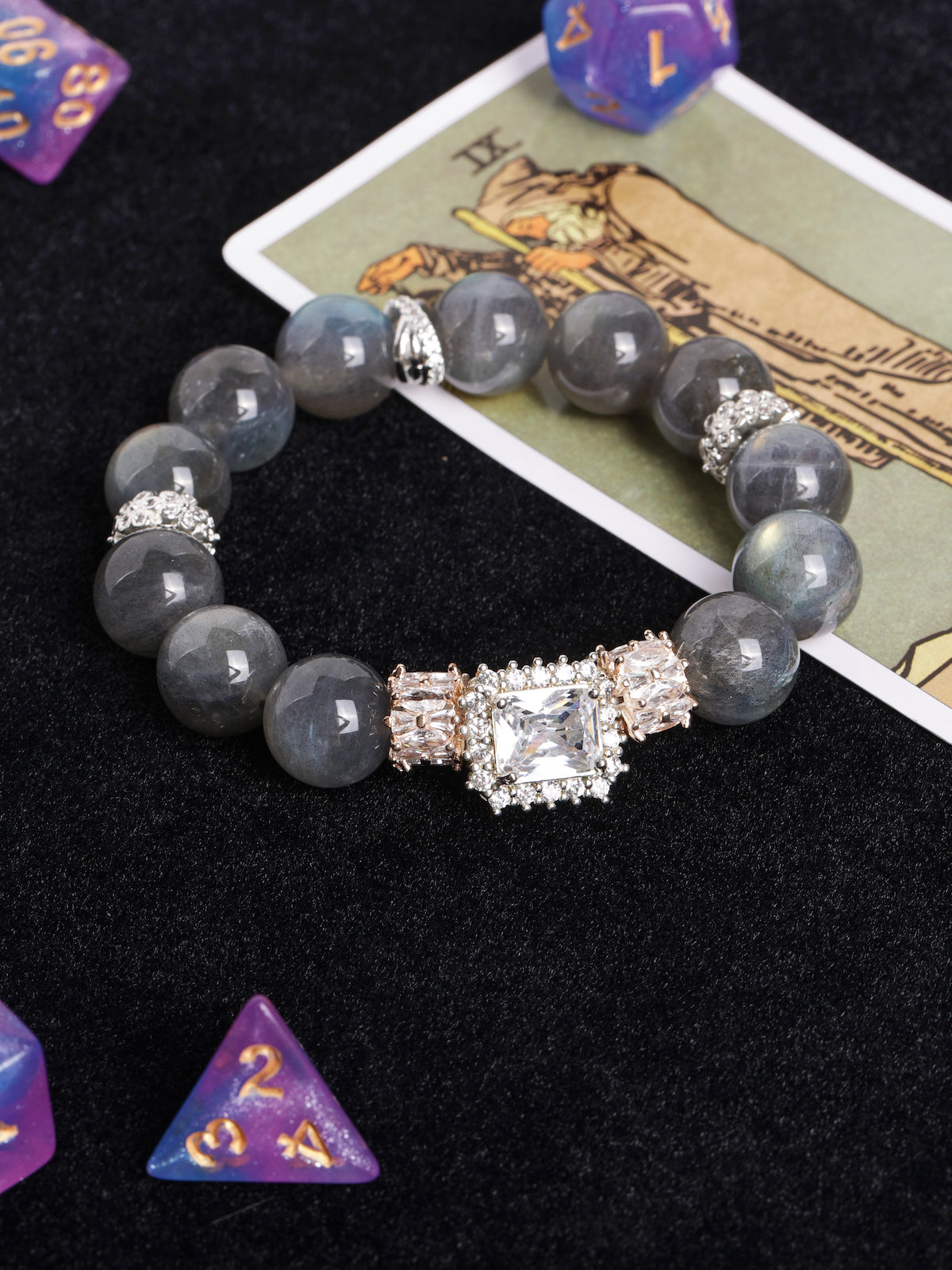 Gray beaded stretch bracelet with large square crystal center and sparkling side details
