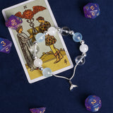 Beaded charm bracelet with light blue and white beads and silver starfish dangle charm