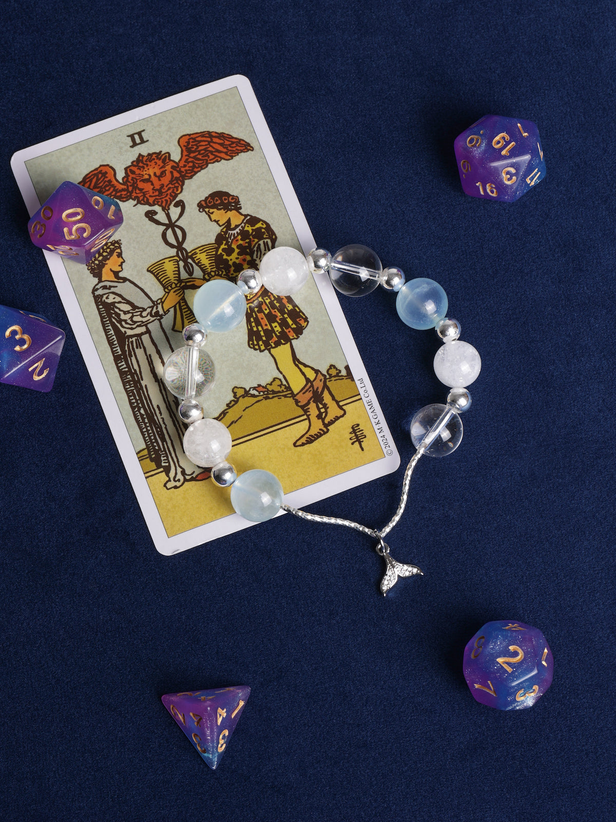 Beaded charm bracelet with light blue and white beads and silver starfish dangle charm