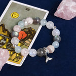 Pastel beaded energy bracelet with dolphin charm and faceted crystal accents
