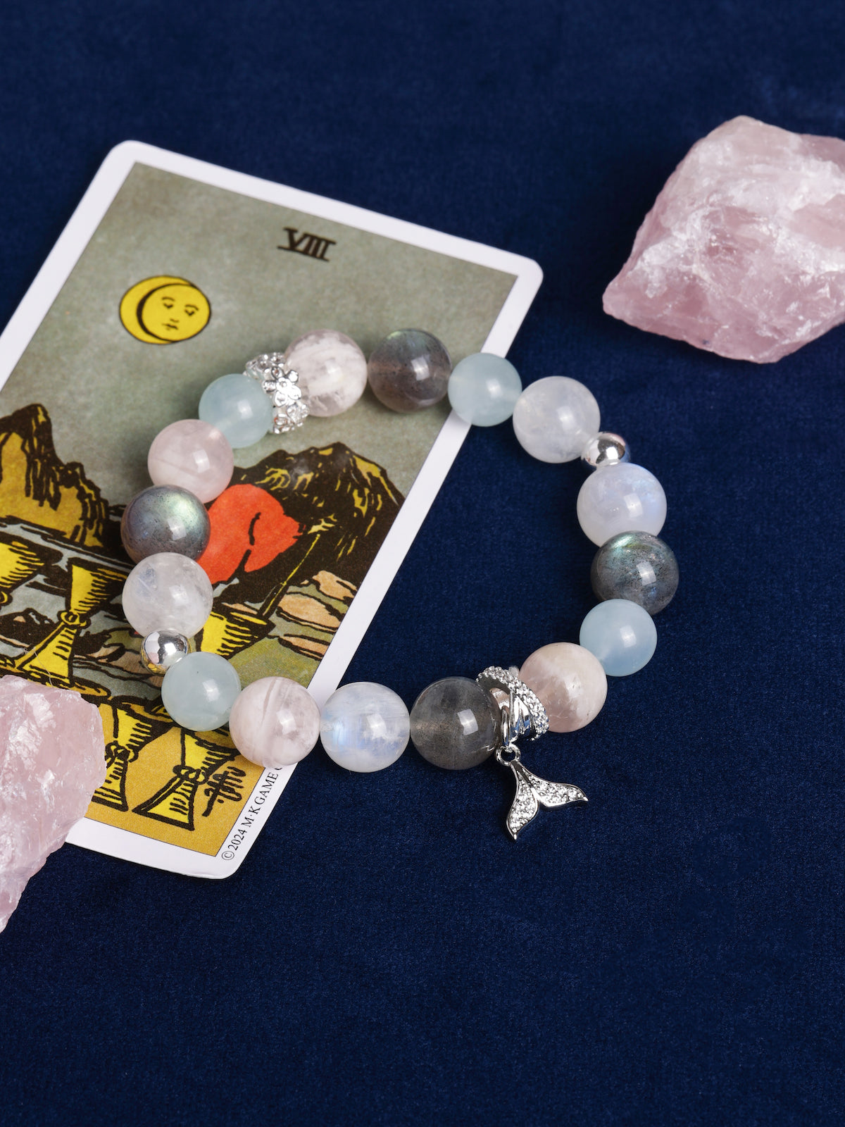 Pastel beaded energy bracelet with dolphin charm and faceted crystal accents