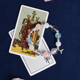 Crystal bead charm bracelet with silver accents, pink and light blue beads