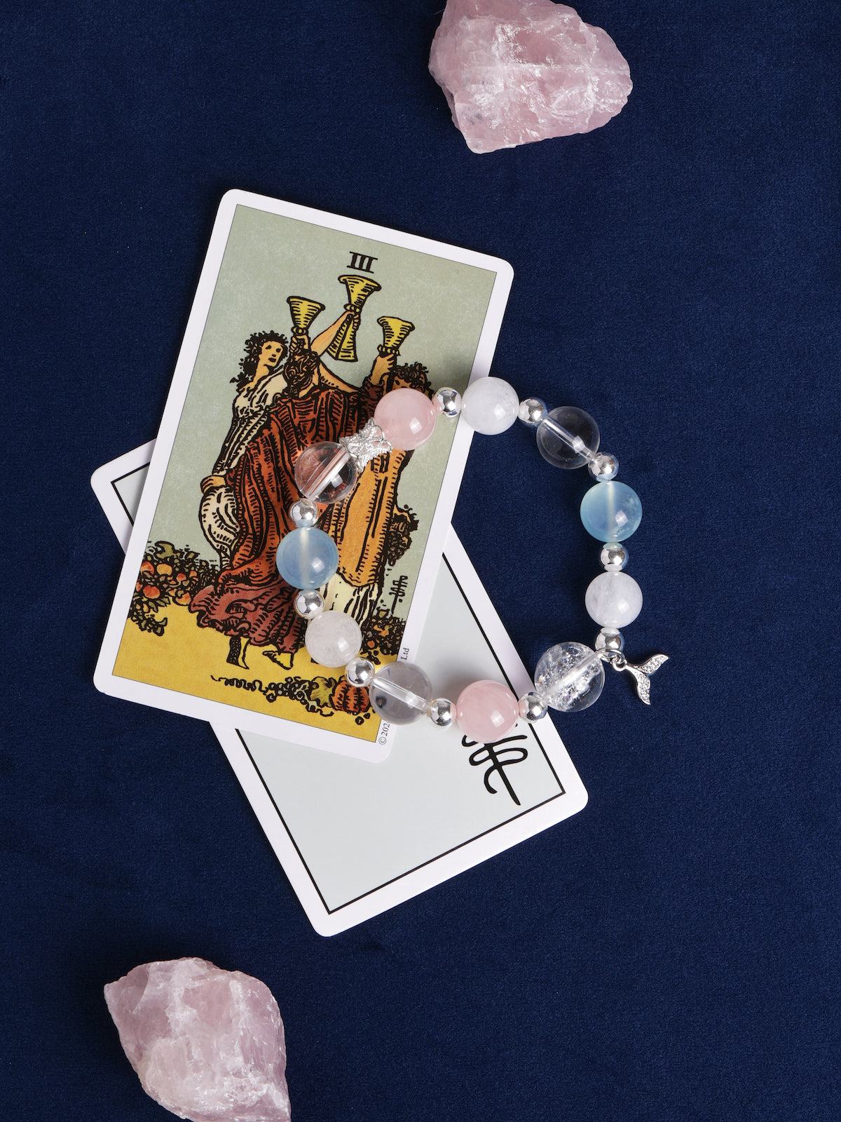 Crystal bead charm bracelet with silver accents, pink and light blue beads