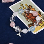 Crystal charm bracelet with pink, pale blue, and clear beads plus starfish charm