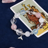Crystal charm bracelet with pink, pale blue, and clear beads plus starfish charm