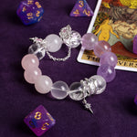 Rose and lilac gemstone bead bracelet with silver-tone star charms and chain links