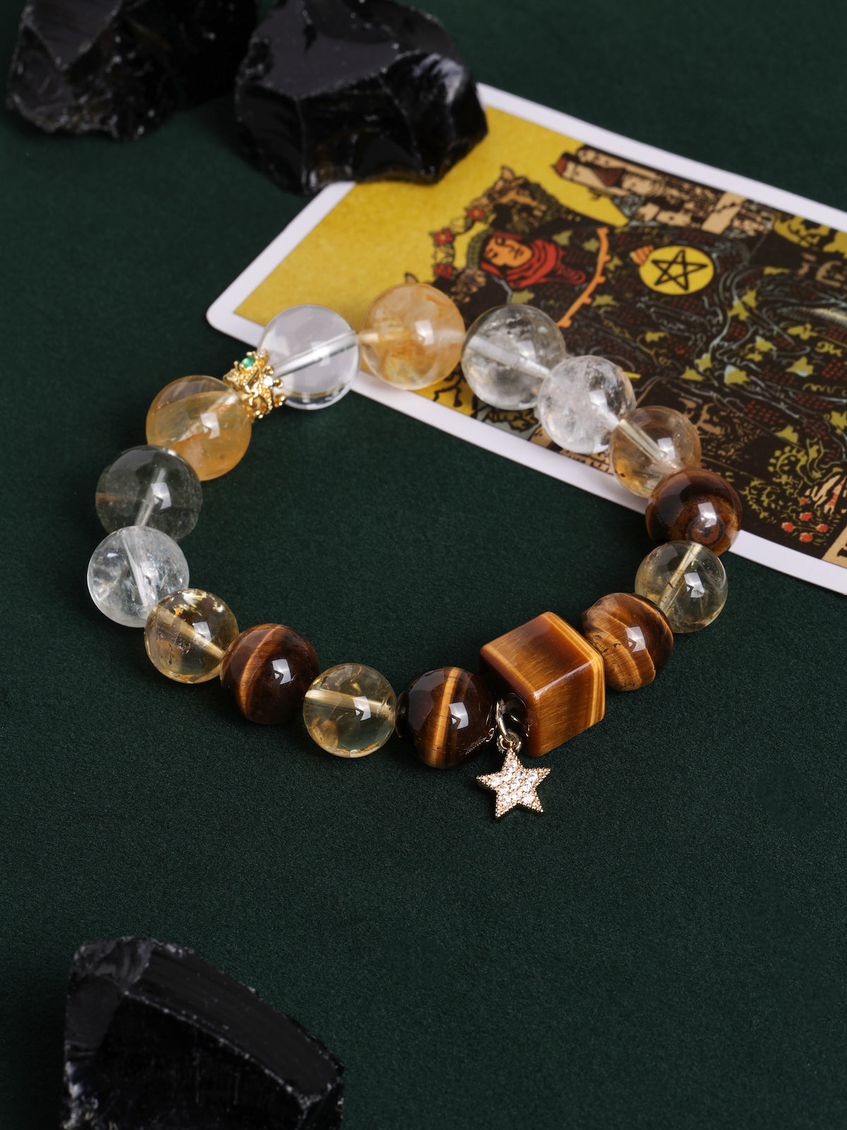 Gemstone bead bracelet with round clear and amber stones, gray beads, gold centerpiece, star charm