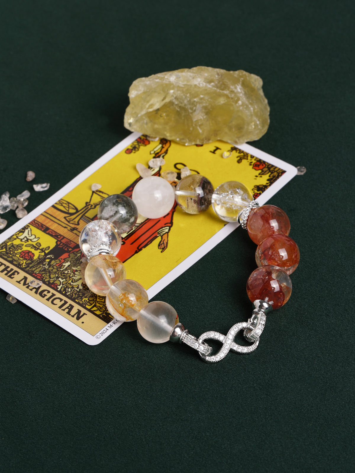 Crystal bead bracelet with mixed gray, clear, and orange/red stones, silver clasp heart links
