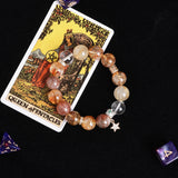 Beaded bracelet with mixed amber and brown stones and star pendant charm