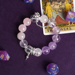 Rose, clear, and lilac beaded bracelet with silver-tone star charm and dangling accents