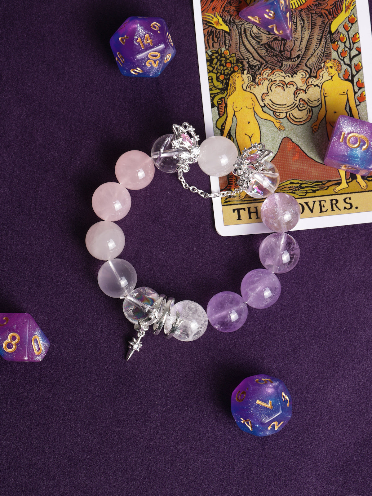 Rose, clear, and lilac beaded bracelet with silver-tone star charm and dangling accents