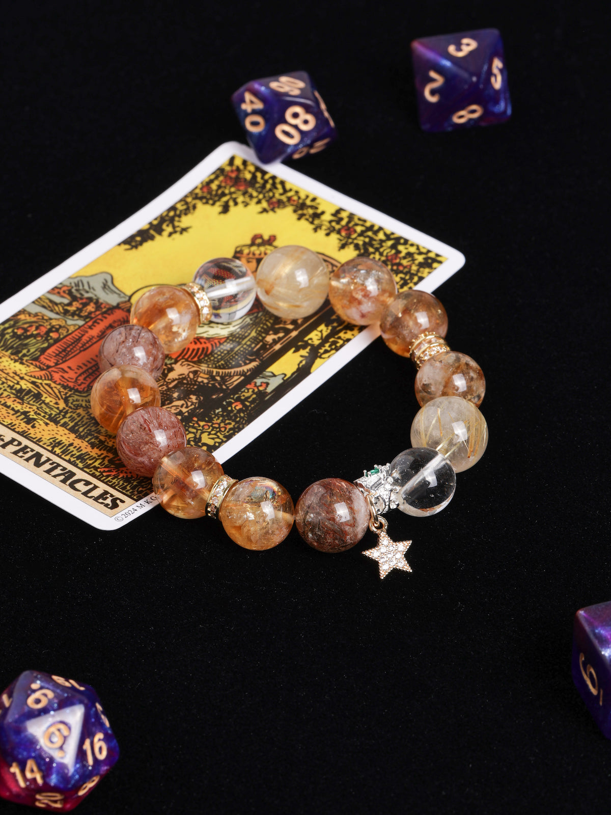 Beaded bracelet with amber, gold, and smoky stones plus star charm and crystal spacer