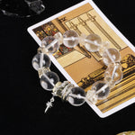 Crystal bead energy bracelet with gold-tone spacers and star-shaped charm