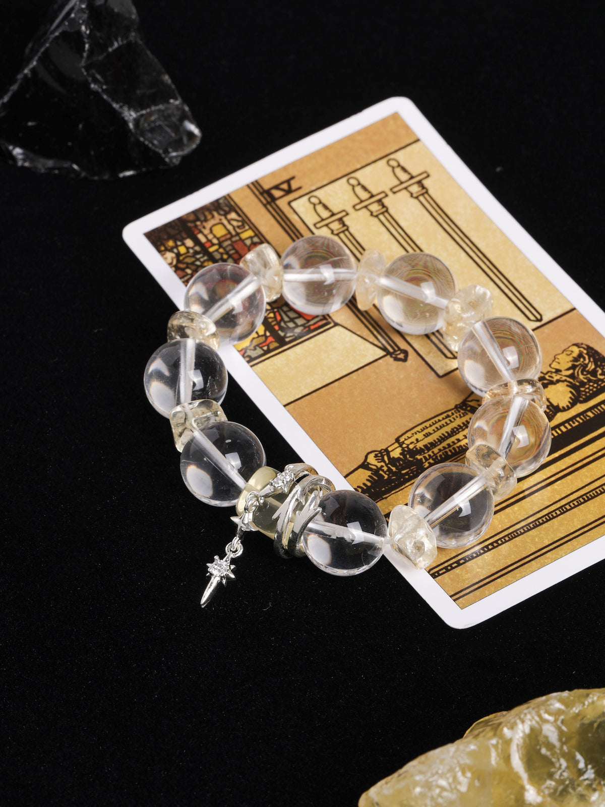 Crystal bead energy bracelet with gold-tone spacers and star-shaped charm