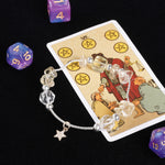 Energy bracelet with silver chain, faceted clear beads, and dangling star charm