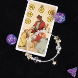 Energy bracelet with silver chain, clear gemlike beads, and star charm