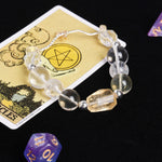 Clear and pale yellow faceted beaded bracelet with silver-toned links