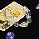 Clear and pale yellow faceted beaded bracelet with silver-toned links