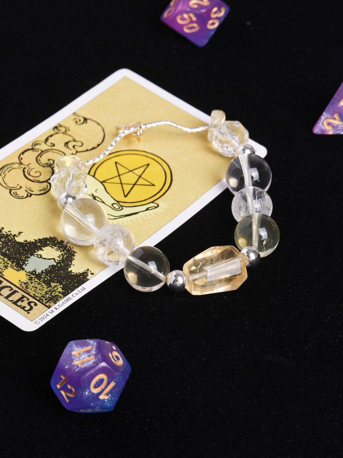 Clear and pale yellow faceted beaded bracelet with silver-toned links