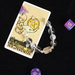 Clear faceted beaded bracelet with gold star charm and round spacers