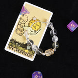 Clear faceted beaded bracelet with gold star charm and round spacers
