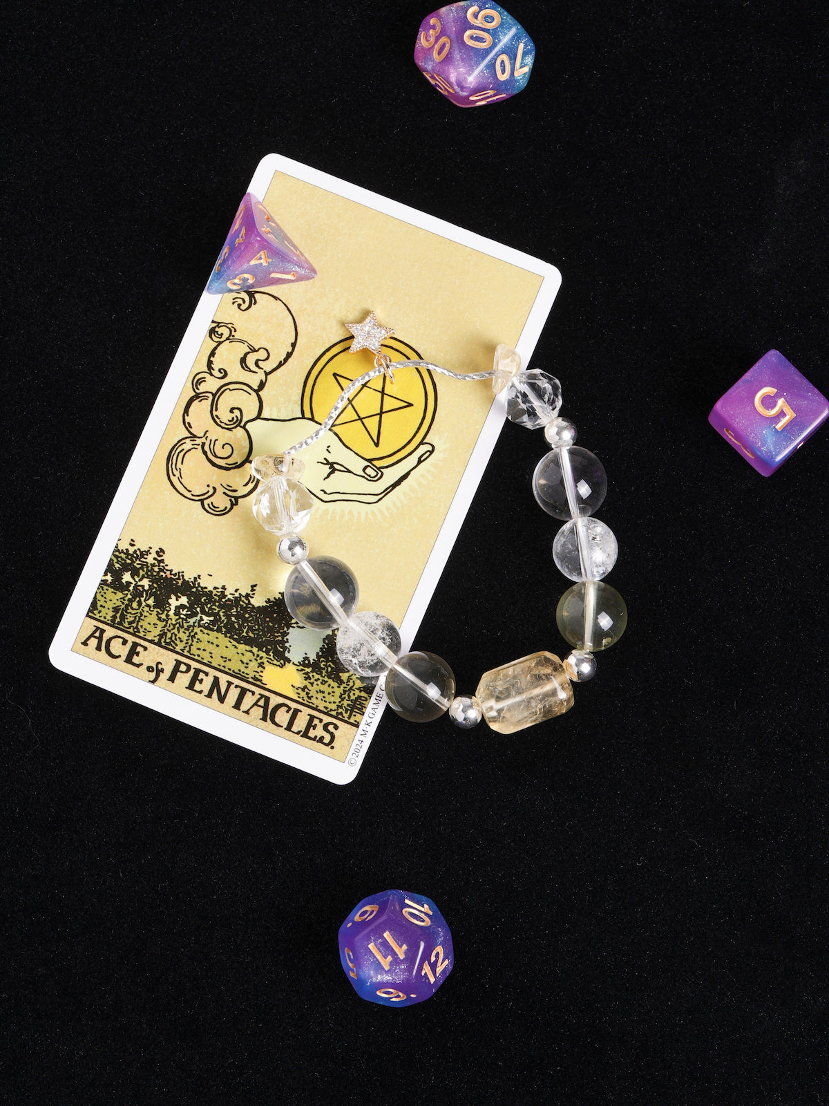 Clear faceted beaded bracelet with gold star charm and round spacers