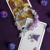 Beaded energy bracelet with lilac and clear beads, blue accent, and angel charm