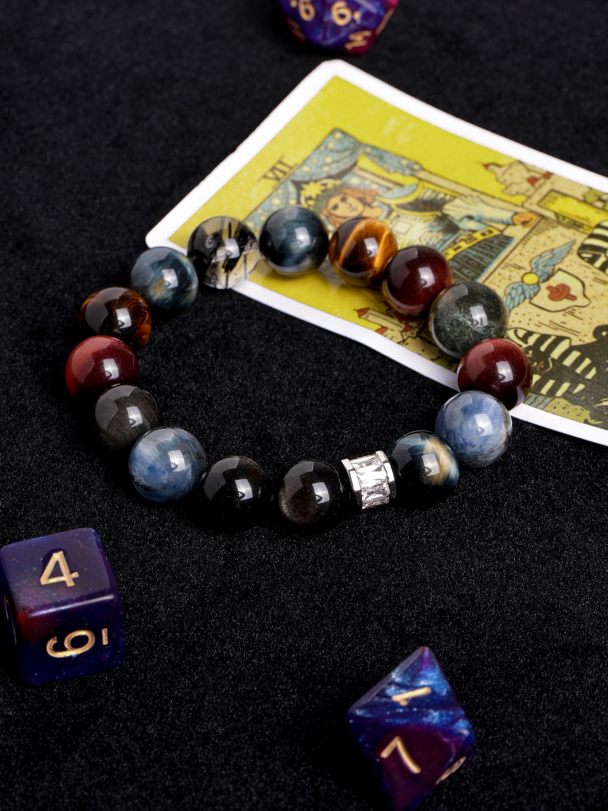 Gemstone bead bracelet featuring dark blue, amber, and red tones with silver clasp detail