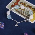 Beaded bracelet with light blue and white beads, clear silver spacers, silver starfish pendant