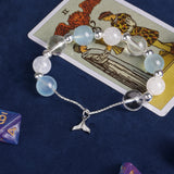 Beaded bracelet with light blue and white beads, clear silver spacers, silver starfish pendant