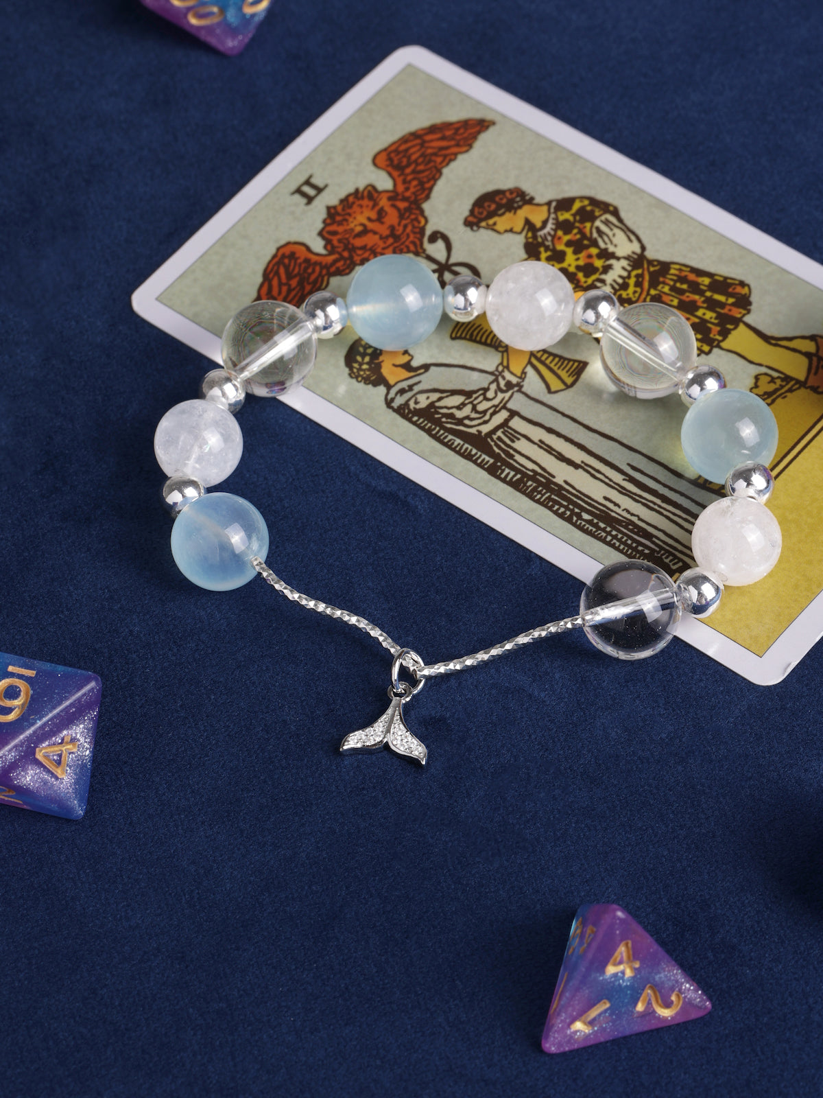 Beaded bracelet with light blue and white beads, clear silver spacers, silver starfish pendant