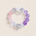 Beaded energy bracelet with pink, purple, and clear stones, silver chain and cross charm