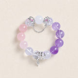 Beaded energy bracelet with pink, purple, and clear stones, silver chain and cross charm