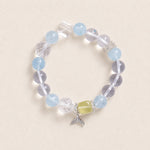 Light blue and clear beaded bracelet with silver charm and yellow center bead