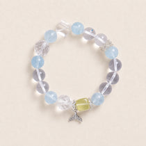 Light blue and clear beaded bracelet with silver charm and yellow center bead