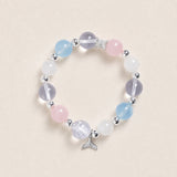 Beaded energy bracelet with pastel light blue, pink, and white stones and silver cup charm