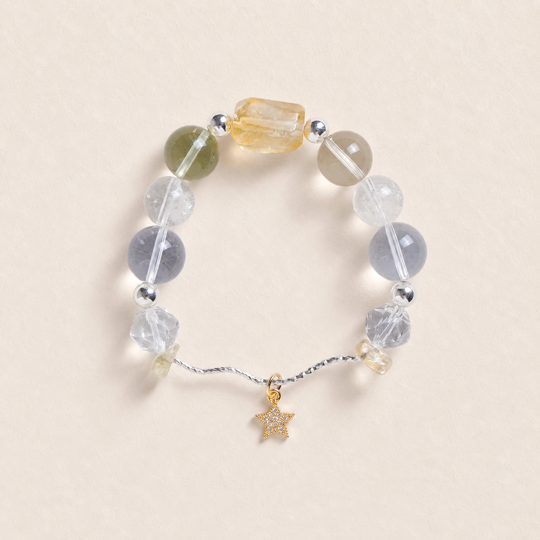 Beaded energy bracelet with translucent stones and small gold star charm