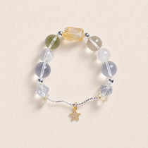 Beaded energy bracelet with translucent stones and small gold star charm