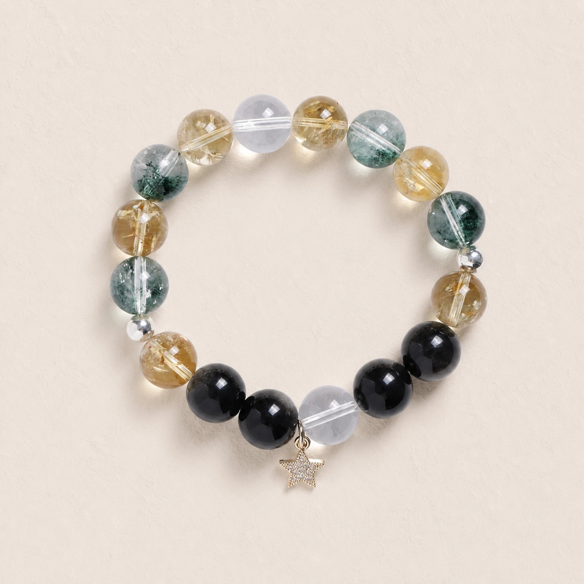 Beaded gemstone bracelet with star charm; clear, yellow, green, and dark black beads