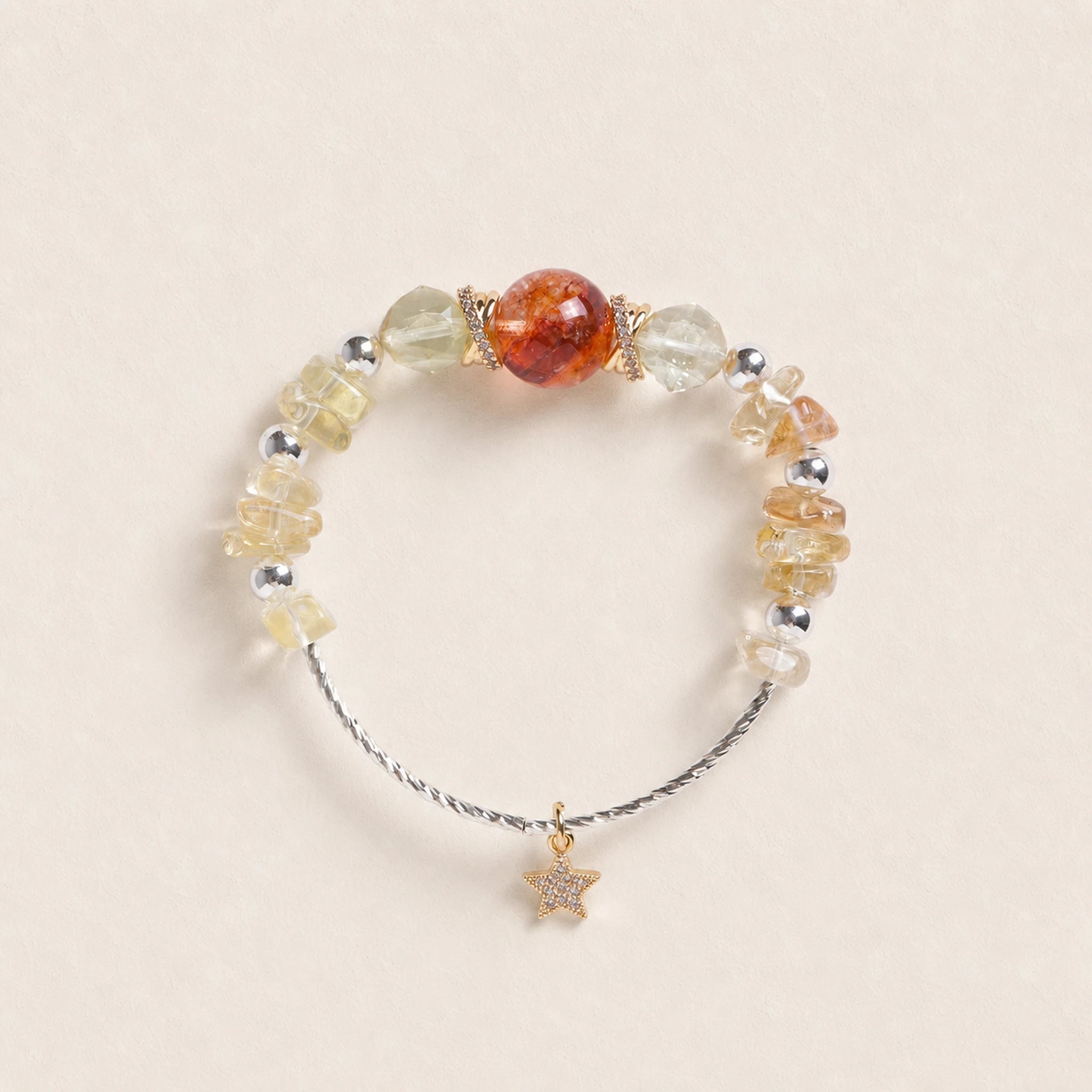 Beaded energy bracelet with amber and clear beads, brown center bead, star charm