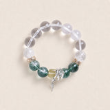 Beaded energy bracelet with clear round stones, green gemstone beads, and silver cross charm