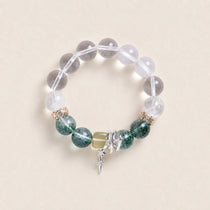 Beaded energy bracelet with clear round stones, green gemstone beads, and silver cross charm